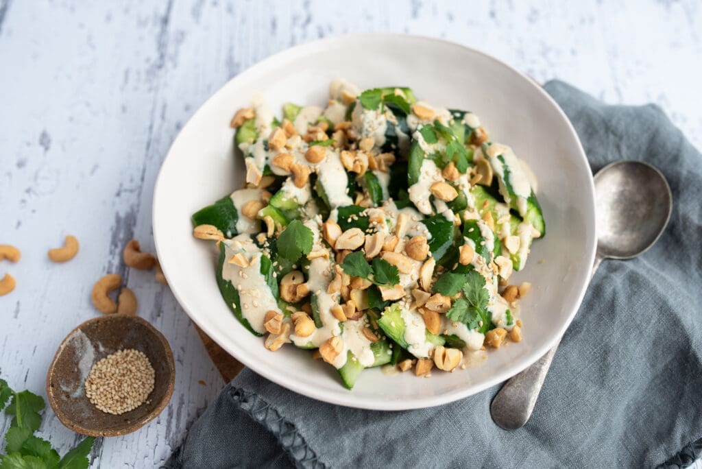 Smashed cucumber salad with creamy ginger-miso peanut dressing